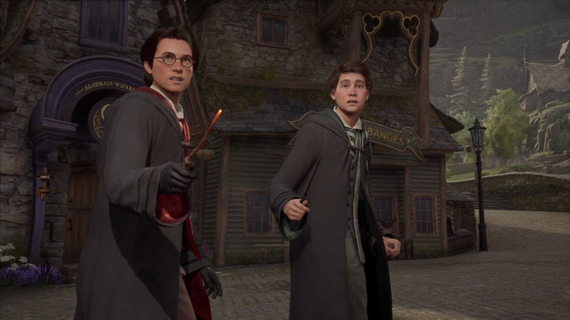 Deux élèves sorciers dans une rue du village dans Hogwarts Legacy sur Nintendo Switch 2