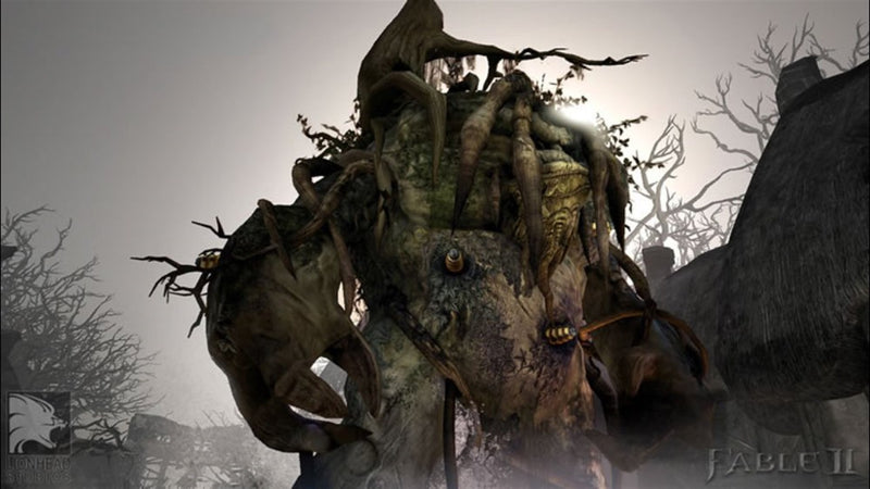 Un troll colossal surgit de la brume dans Fable II: Game of the Year Edition sur Xbox 360