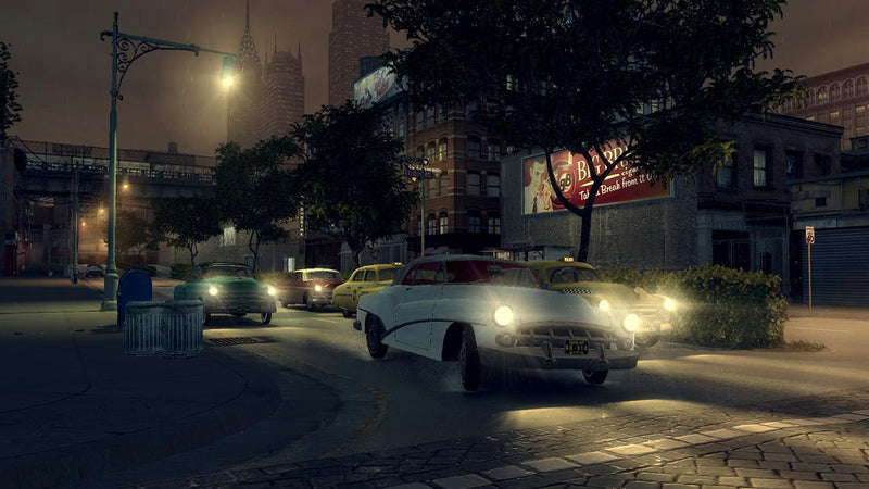 Voitures d'époque dans une rue de nuit dans Mafia II sur PC