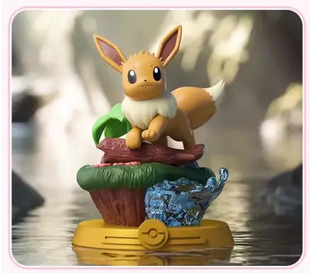 Figurine Pokémon Évoli 12 cm sur tronc d’arbre avec détails naturels, mousse et eau cristallisée