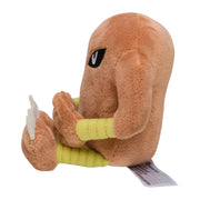 Peluche Pokémon Kicklee en coton doux 15 cm, tan avec oeil noir et bras rayés jaunes assise
