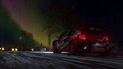 Voiture de rallye Citroën rouge et blanche avec autocollants noirs dans DIRT 5 PS5