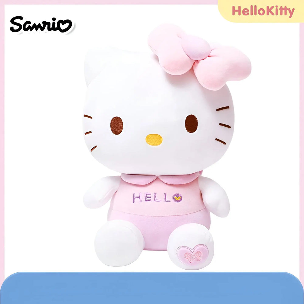 Peluche Hello Kitty 30 cm en combinaison rose avec hello et cœurs