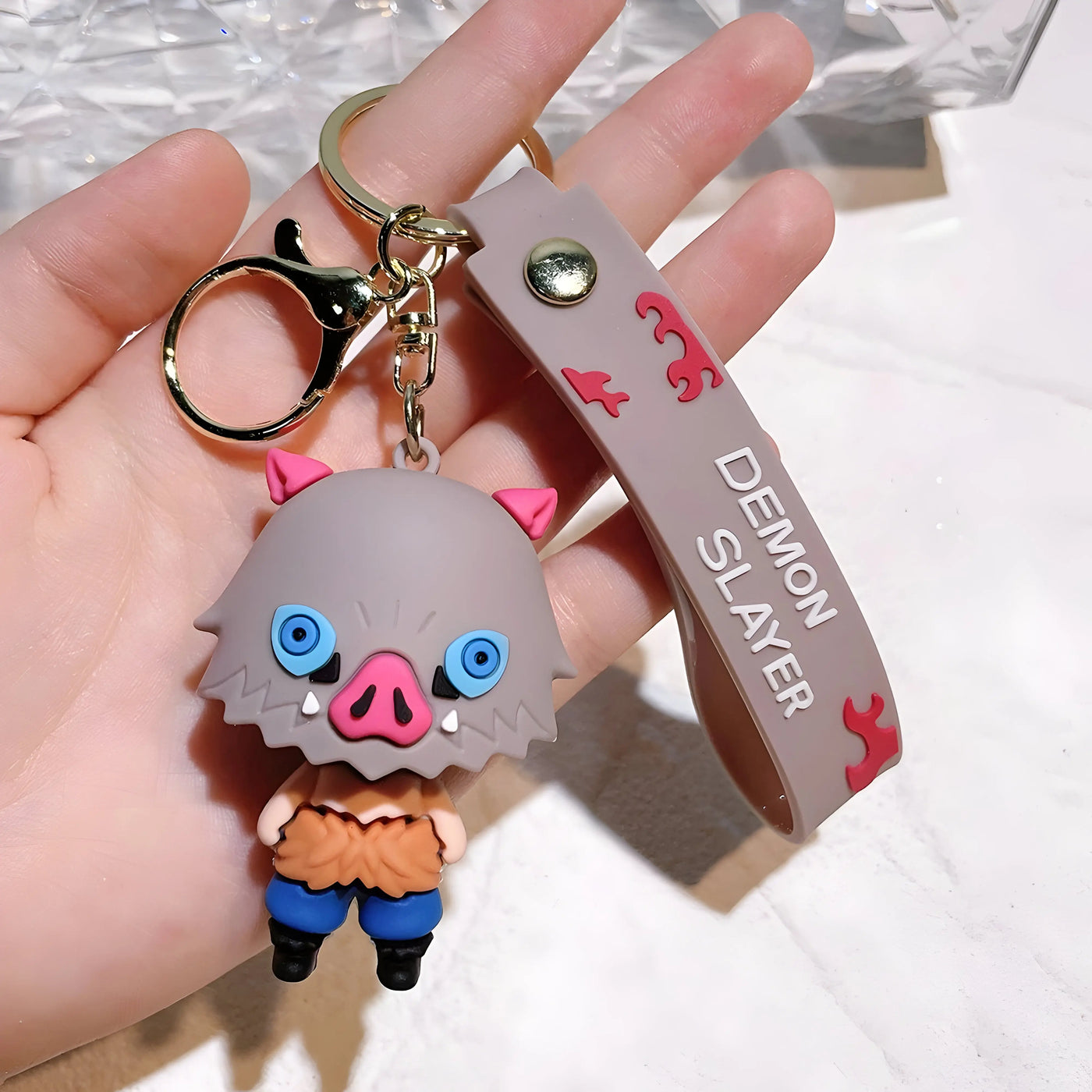 Porte-clés Demon Slayer Inosuke Hashibira porcelet gris avec sangle
