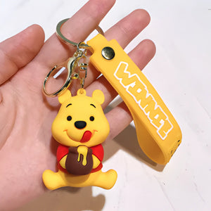 Porte clés Disney - Winnie l’Ourson avec son Pot de miel