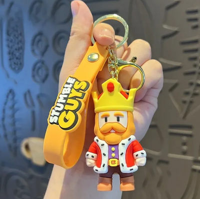 Porte-clés jaune Stumble Guys Stumble King avec couronne et robe rouge