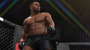 Combattant musclé torse nu en short noir et gants UFC rouge-noir dans cage UFC 2 PS4
