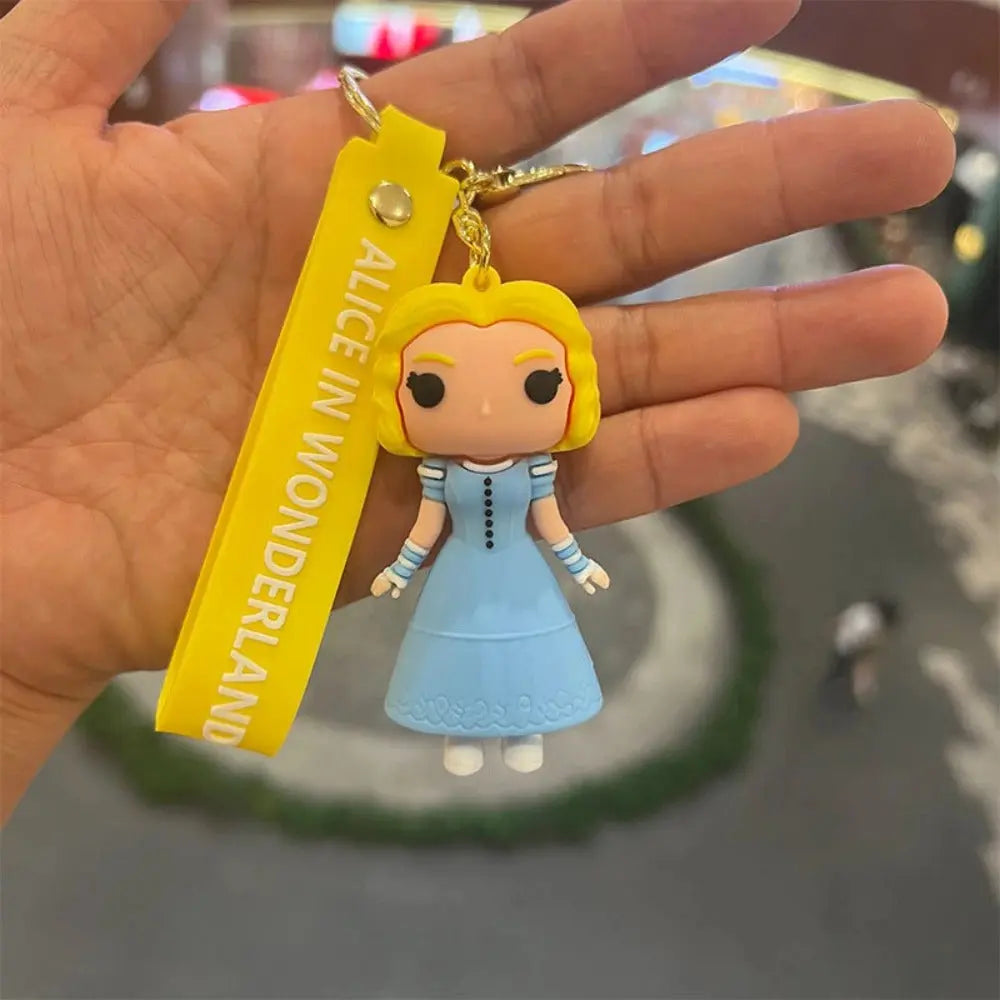 Porte-clés Disney Alice POP jaune et bleu figurine blonde en robe bleue