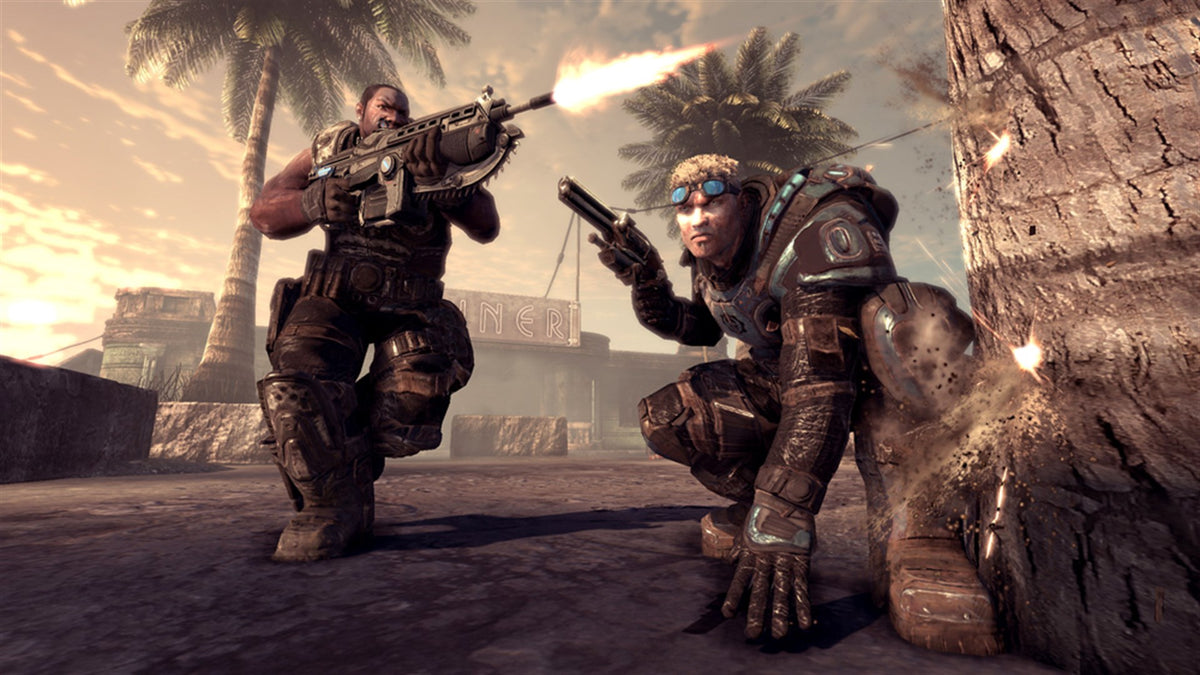 Deux soldats COG au combat dans des ruines au soleil couchant, fond d'écran officiel Gears of War 2