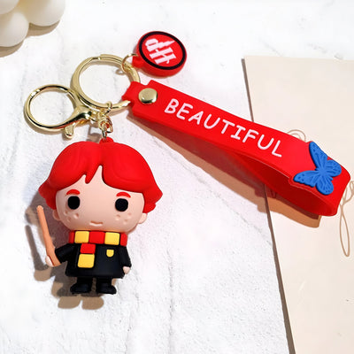 Porte-clés Harry Potter Ron Weasley rouge caoutchouc avec papillon bleu