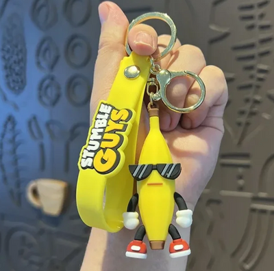 Porte-clés Stumble Guys Banana Guy jaune avec lunettes et chaussures rouges