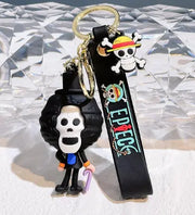 Porte-clés One Piece Brook : crâne aux cheveux frisés, chapeau de paille en caoutchouc noir