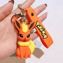 Porte-clés Pokémon Pyroli orange avec accents jaunes et sangle logo