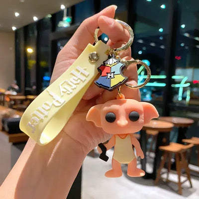 Porte-clés Harry Potter Dobby peach avec sangle jaune et yeux noirs