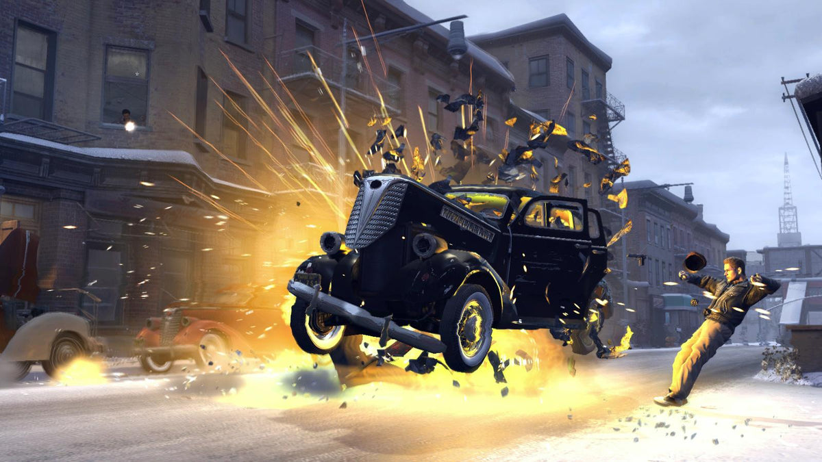 Une voiture explose dans une rue enneigée dans Mafia II sur PC